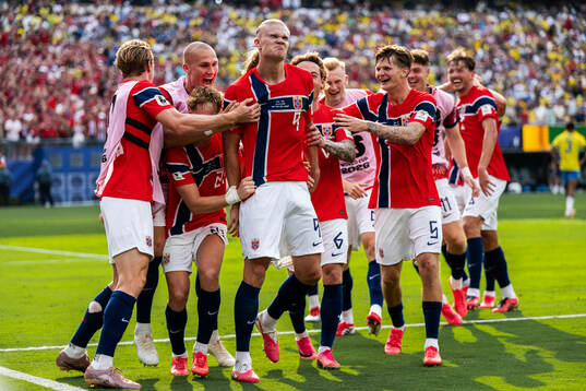 Erling Braut Haaland of Norway celebrate with team mates