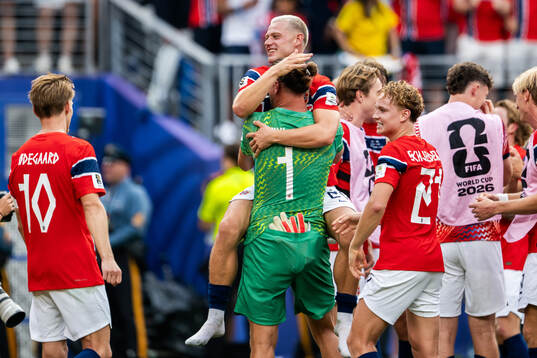 Julian Ryerson and goalkeeper Ørjan Nyland of Norway