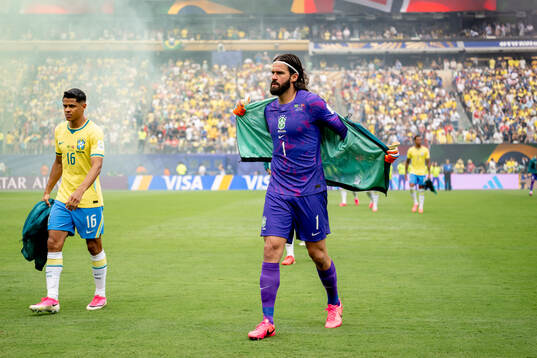 Douglas Santos and goalkeeper Alisson of Brazil