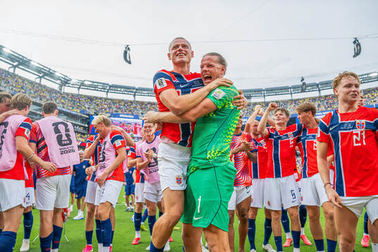 Julian Ryerson and goalkeeper Ørjan Nyland of Norway
