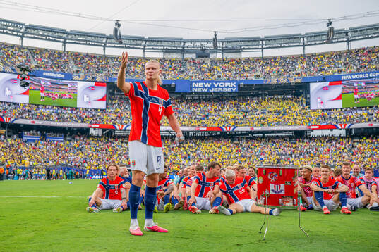 Erling Braut Haaland and players of Norway celebrate with a
