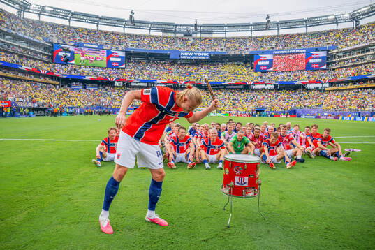 Erling Braut Haaland and players of Norway celebrate with a