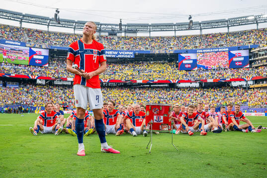 Erling Braut Haaland and players of Norway celebrate with a