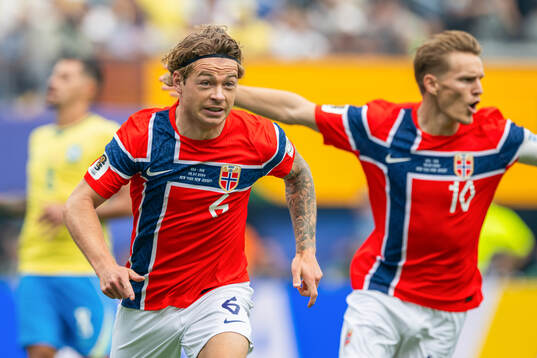 Patrick Berg of Norway celebrates scoring a later
