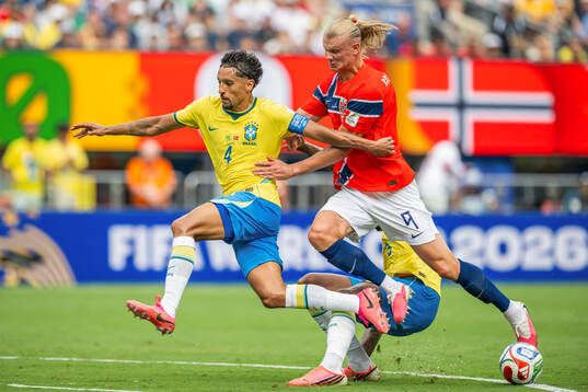 Marquinhos of Brazil and Erling Braut Haaland of Norway