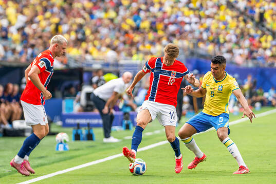Martin Ødegaard of Norway and Casemiro of Brazil
