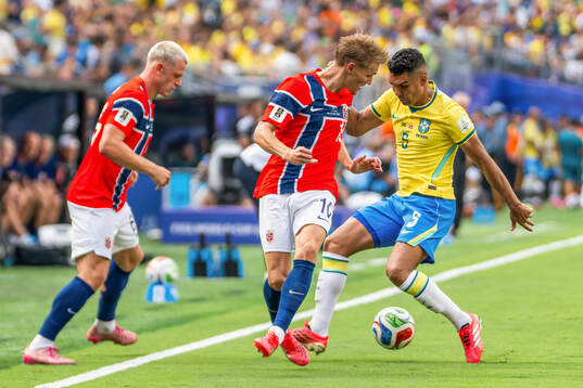Martin Ødegaard of Norway and Casemiro of Brazil