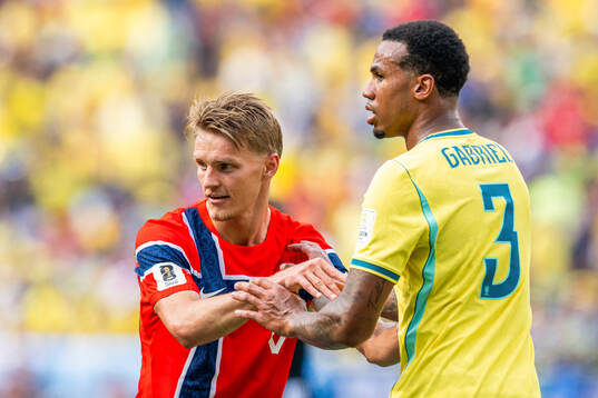 Martin Ødegaard of Norway and Gabriel Magalhaes of Brazil