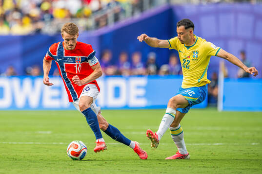 Martin Ødegaard of Norway and Gabriel Martinelli of Brazil