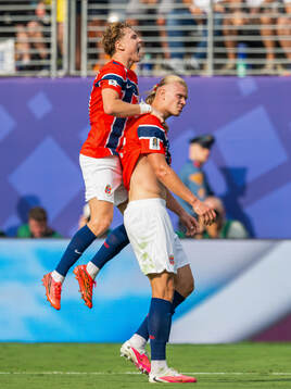Erling Braut Haaland of Norway celebrates with teammate