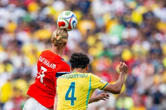 Erling Braut Haaland of Norway and Marquinhos of Brazil