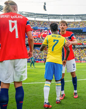Vinicius Junior of Brazil and Sander Berge of Norway