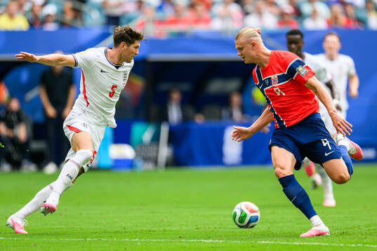 John Stones of England and Erling Braut Haaland of Norway