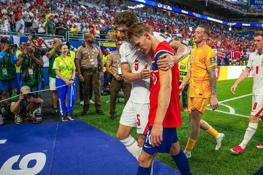 John Stones of England and Martin Ødegaard of Norway