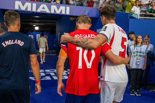 Martin Ødegaard of Norway and John Stones of England