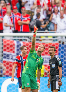 Goalkeeper Ørjan Håskjold Nyland of Norway talks to