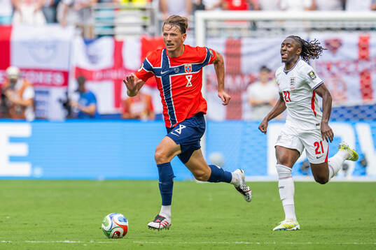 Sander Berge of Norway and Eberechi Eze of England
