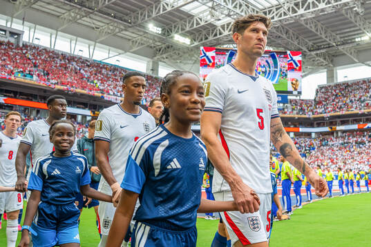 John Stones of England enters the pitch