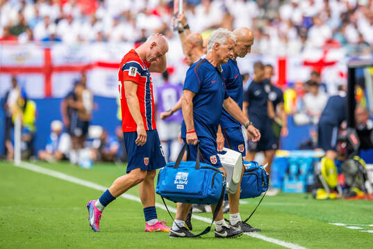 Julian Ryerson of Norway walks off injured