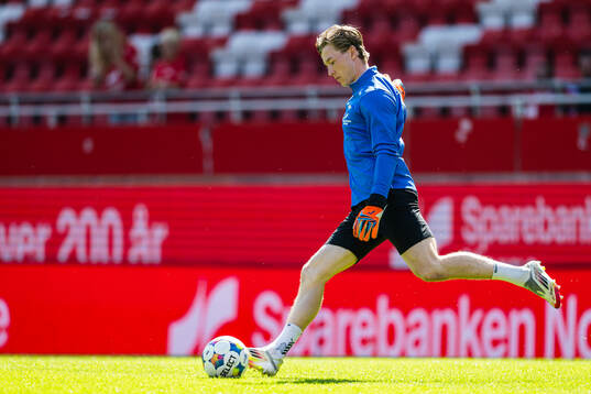 Goalkeeper Mathias Dyngeland of Brann warms up