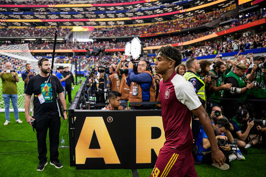 Lamine Yamal of Spain enters the pitch for warm-up