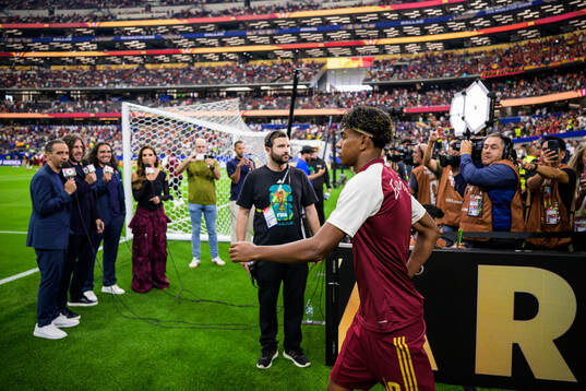 Lamine Yamal of Spain enters the pitch for warm-up