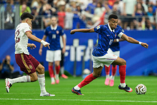 Pau Cubarsi of Spain and Kylian Mbappe of France