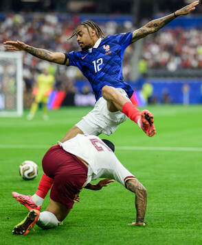 Pedro Porro of Spain and Bradley Barcola of France