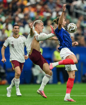Dani Olmo of Spain and Adrien Rabiot of France