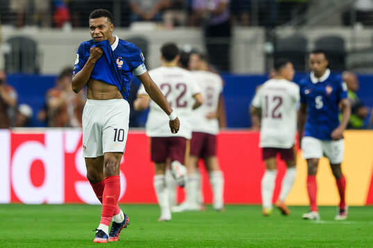 Kylian Mbappe of France looks dejected