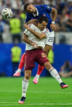 Maxence Lacroix of France and Mikel Oyarzabal of Spain