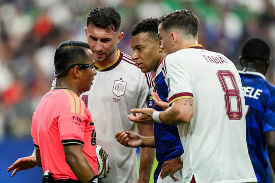 Aymeric Laporte and Fabian Ruiz of Spain, Kylian Mbappe of