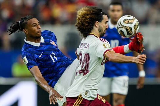 Michael Olise of France and Marc Cucurella of Spain