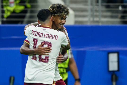 Pedro Porro and Lamine Yamal of Spain celebrate