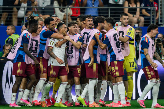 Pedro Porro of Spain celebrate with teammates