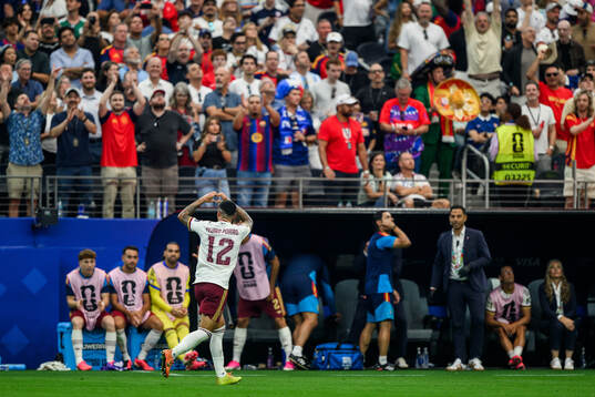 Pedro Porro of Spain celebrates