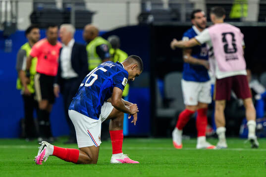Maxence Lacroix of France looks dejected