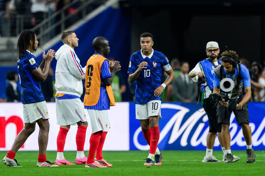 Kylian Mbappe of France looks dejected