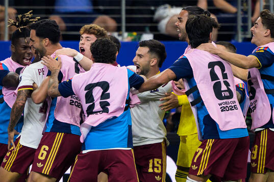 Pedro Porro of Spain celebrates with teammates