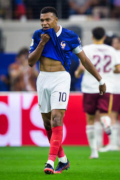 Kylian Mbappe of France looks dejected