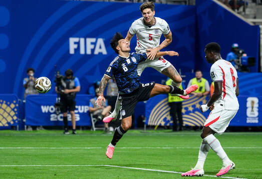 Lisandro Martinez of Argentina and John Stones of England