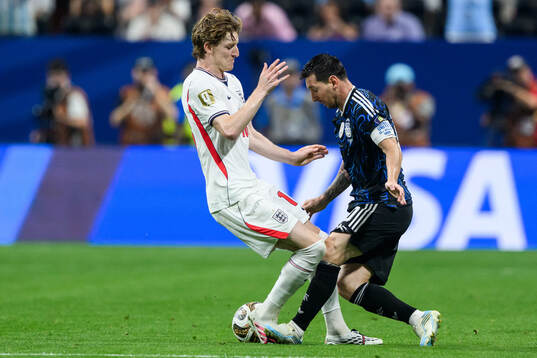 Anthony Gordon of England and Lionel Messi of Argentina