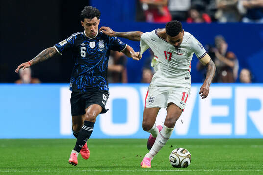 Lisandro Martinez of Argentina and Morgan Rogers of England
