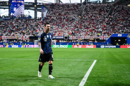 Lionel Messi of Argentina leaves the pitch at half time