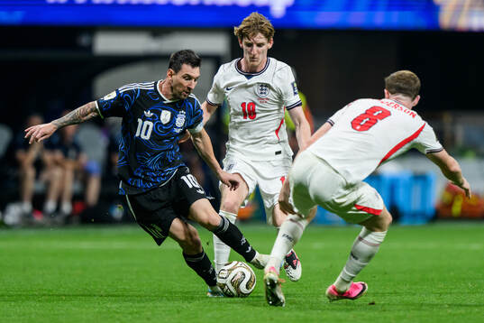 Lionel Messi of Argentina and Anthony Gordon and Elliot