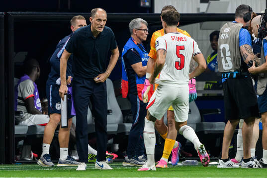Head coach Thomas Tuchel and John Stones of England