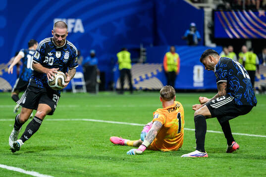 Alexis Mac Allister and Cristian Romero of Argentina