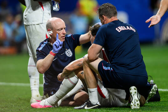 John Stones of England recieves medical attention