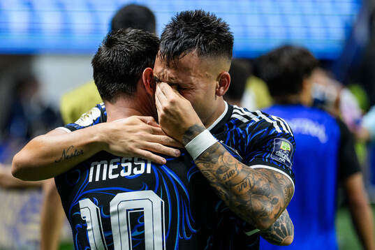 Lionel Messi and Lautaro Martinez of Argentina celebrate