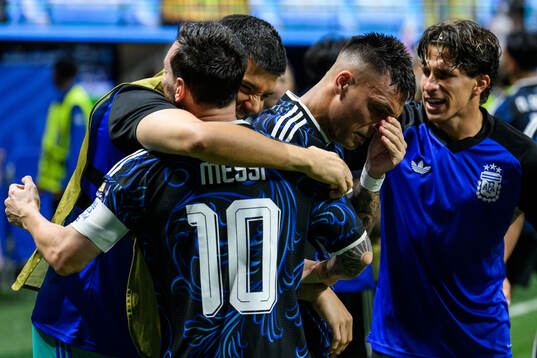 Lionel Messi and Lautaro Martinez of Argentina celebrate